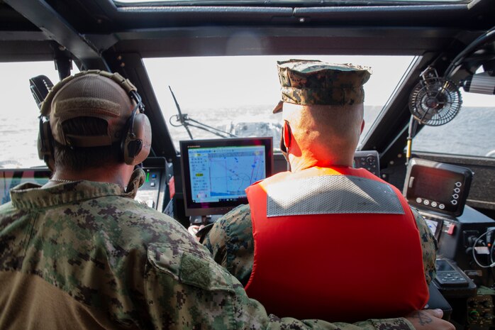 U.S. Marine Corps Brig. Gen. William E. Souza III, Deputy Commander of Marine Forces Reserve and Marine Forces North, operates the Mark IV patrol boat during his visit to Navy Expeditionary Combat Command (NECC), Aug. 27, 2020, on Joint Expeditionary Base Little Creek in Virginia Beach, Virginia. The event familiarized Marine Corps leadership with U.S. Navy capabilities, and provided insight on the mission of Naval Expeditionary Combat Command. (U.S. Marine Corps photo by Sgt. Desmond Martin/released)