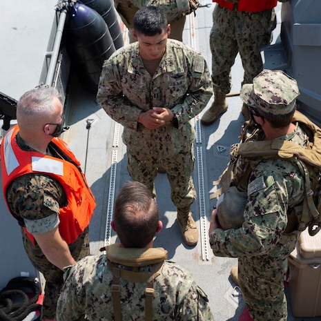 U.S. Navy Sailors with Alpha and Bravo Company, Coastal Rivron Four, Naval Expeditionary Combat Command (NECC) explains the capabilities of the Mark IV Patrol Boat to U.S. Marine Corps Brig. Gen. William E. Souza III, Deputy Commander of Marine Forces Reserve and Marine Forces North, Aug. 27, 2020, on Joint Expeditionary Base Little Creek, in Virginia Beach, Virginia on Joint Expeditionary Base Little Creek in Virginia Beach, Virginia. The event familiarized Marine Corps leadership with U.S. Navy capabilities, and provided insight on the mission of Naval Expeditionary Combat Command. (U.S. Marine Corps photo by Sgt. Desmond Martin/released)
