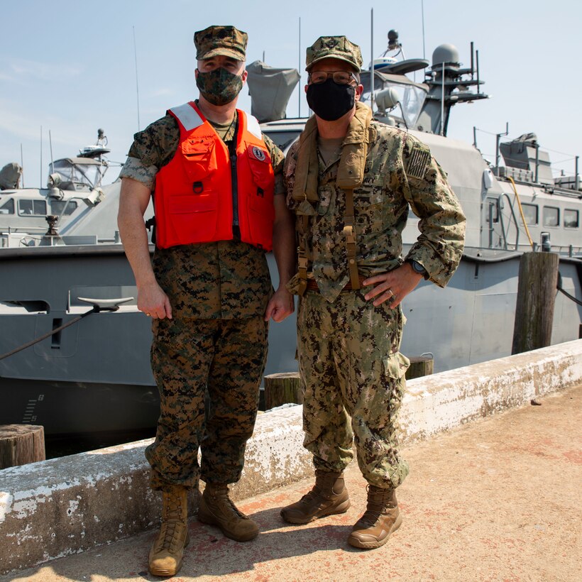 U.S. Marine Corps Brig. Gen. William E. Souza III, Deputy Commander of Marine Forces Reserve and Marine Forces North, left, and Rear Adm. Joseph A. DiGurando, perspective Commander of the Navy Expeditionary Combat Command (NECC), right, poses for a photo Aug. 27, 2020, on Joint Expeditionary Base Little Creek in Virginia Beach, Virginia. The event familiarized Marine Corps leadership with U.S. Navy capabilities, and provided insight on the mission of Naval Expeditionary Combat Command. (U.S. Marine Corps photo by Sgt. Desmond Martin/released)