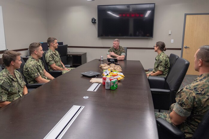 Midshipmen participate in a luncheon with Master Gunnery Sgt. Scott H. Stalker, senior enlisted leader of United States Cyber Command at Marine Corps Forces Cyber Command at Fort Meade, Maryland, August 14.