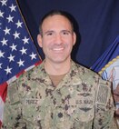 Official photo Commander Albert Perez, executive officer, Naval Computer and Telecommunications Station Bahrain.