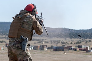 A man fires a gun.