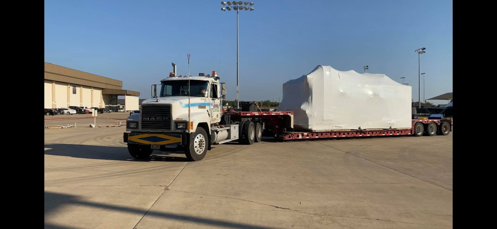 A hypobaric altitude chamber from Tyndall claims the 344th Training Squadron Career Enlisted Aviator Center of Excellence hangar as its new home at Joint Base San Antonio-Lackland, Texas, Aug. 25, 2020.