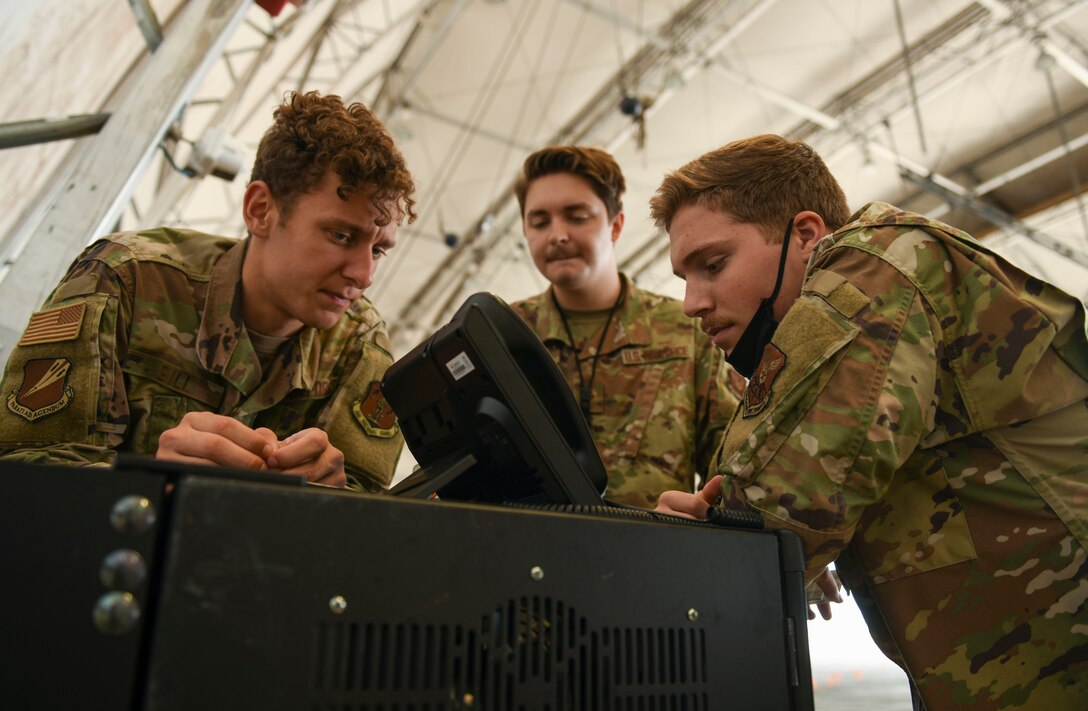 U.S. Air Force Staff Sgt. Dakota Gill, Staff Sgt. Robert Sheridan and Senior Airman Dylan Winslow, 393rd Expeditionary Bomb Squadron communications support team, Whiteman Air Force Base, Missouri, trouble shoot communication network connectivity to U.S. Air Force Global Strike Command’s first mobile operations center during a deployment to Naval Support Facility Diego Garcia, August 20, 2020. Air Force Global Strike Command’s development of the mobile operations center is based on the National Defense Strategy’s objective to build lethality, strengthen alliances and streamline processes. Once implemented across AFGSC, the mobile operations center will allow commanders across the world to employ bomber forces to ensure a free and open Indo-Pacific and ability of AFGSC to deliver lethal, ready, long-range strike options anytime, anywhere. (U.S. Air Force photo by Tech. Sgt. Heather Salazar)