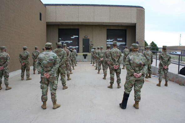 Airmen from the 50th Civil Engineer Squadron listen to guidance prior to Prime Base Engineer Emergency Force training at Schriever Air Force Base, Colorado, Aug. 20, 2020. Prime BEEF training, which occurs the third Thursday of each month, prepares engineer forces to execute operations down range, which can include hands-on training like land navigation, CPR and individual or team tactical movements. (Courtesy photo)