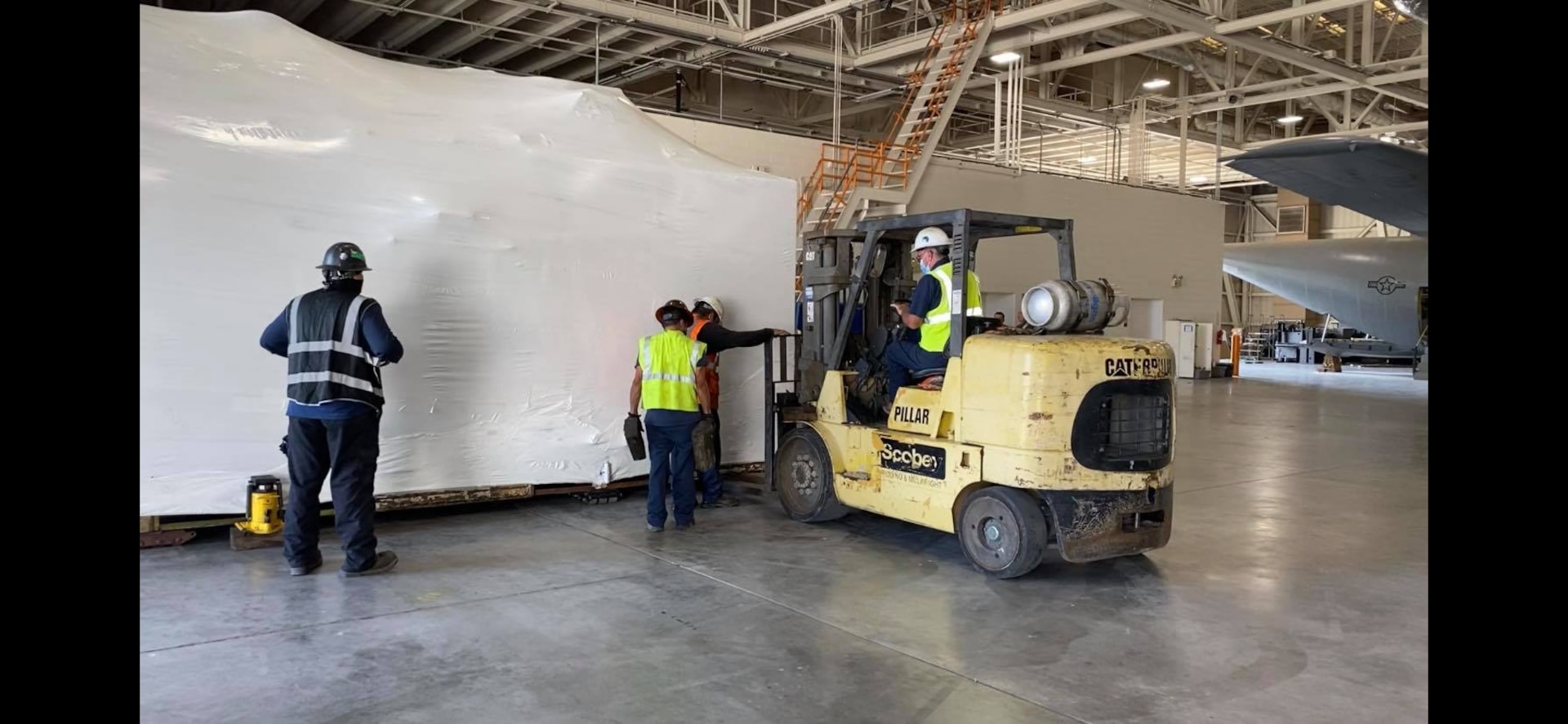 A hypobaric altitude chamber from Tyndall claims the 344th Training Squadron Career Enlisted Aviator Center of Excellence hangar as its new home at Joint Base San Antonio-Lackland, Texas, Aug. 25, 2020.