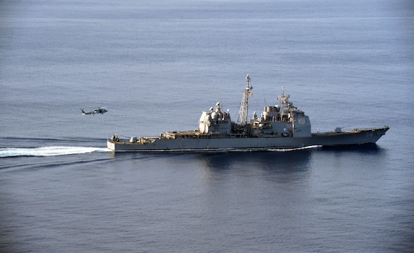 The Ticonderoga-class guided-missile cruiser USS Philippine Sea (CG 58) participates in a vertical replenishment-at-sea exercise with a Sikorsky Seahawk helicopter assigned to the Spanish frigate Álvaro de Bazán (F 101) in the Mediterranean Sea, Aug. 26, 2020. Philippine Sea is currently deployed to the U.S. 6th Fleet area of operations in support of regional allies and partners and U.S. national security interests in Europe and Africa.
