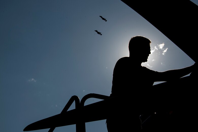 A photo of an Airman performing maintenance on an HC-130J