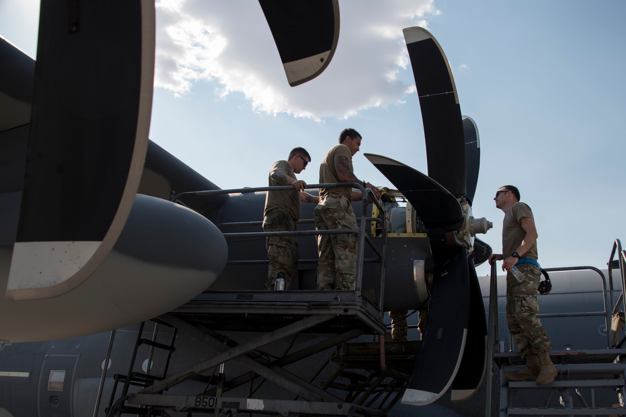 A photo of an Airman performing maintenance on an HC-130J
