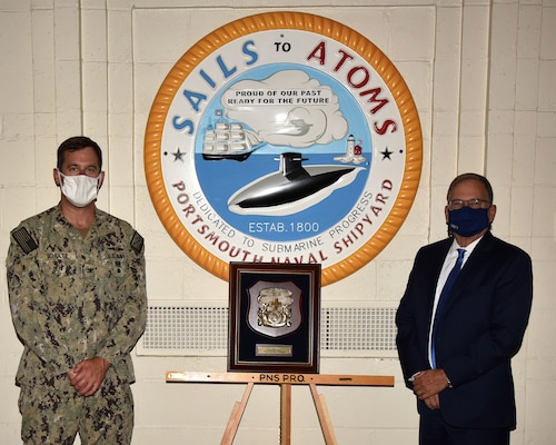 Portsmouth Naval Shipyard, Kittery, Maine, August 24, 2020: (left) The Honorable Charles A Williams, Assistant Secretary of the Navy (Energy, Installations and Environment) presents Capt. William Schultz, Shipyard Production Officer, with the Secretary of the Navy 2019 Shore Safety Award (Large Industrial) while visiting the shipyard. (U.S. Navy photo by Jim Cleveland/Released)