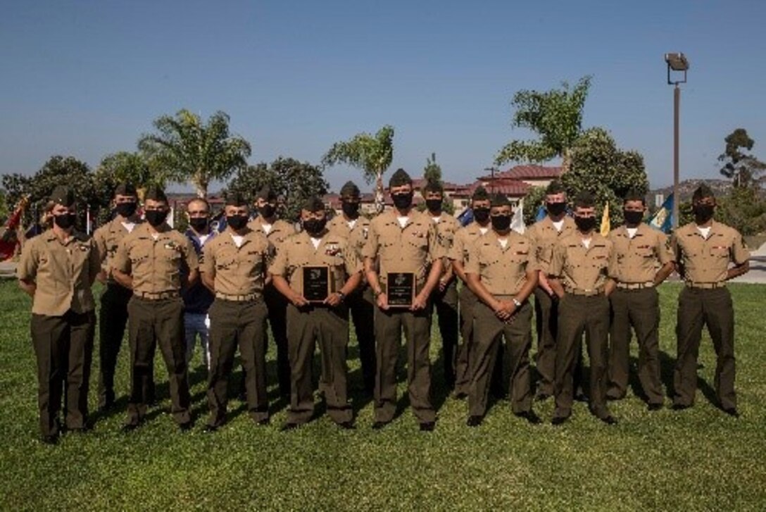 U.S. Marine Corps Expeditionary Contracting Platoon, Combat Logistics Regiment 17, 1st Marine Logistics Group, I Marine Expeditionary Force, pose for a group photo after receiving Expeditionary Contracting Team of the Year award during an award ceremony on Marine Corps Base Camp Pendleton, California, Aug. 25, 2020.