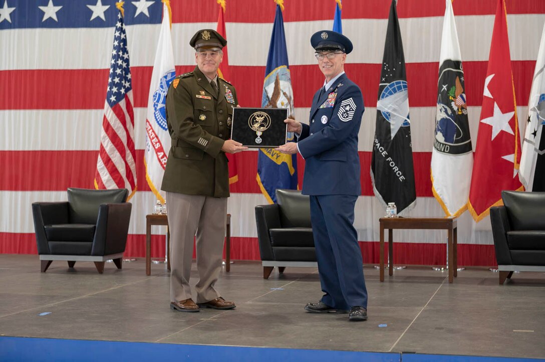 U.S. Army Gen. James Dickinson, U.S. Space Command commander, presents U.S. Space Force Chief Master Sgt. Roger Towberman with the Defense Superior Service Medal in honor of his work as USSPACECOM’s command senior enlisted leader Aug. 28, 2020, at Peterson Air Force Base, Colorado. Towberman served as USSPACECOM’s CSEL from its establishment on Aug. 29, 2019, until relinquishing responsibility of the combatant command’s highest enlisted position Aug. 28, 2020. He will continue to serve at USSF’s CSEL.