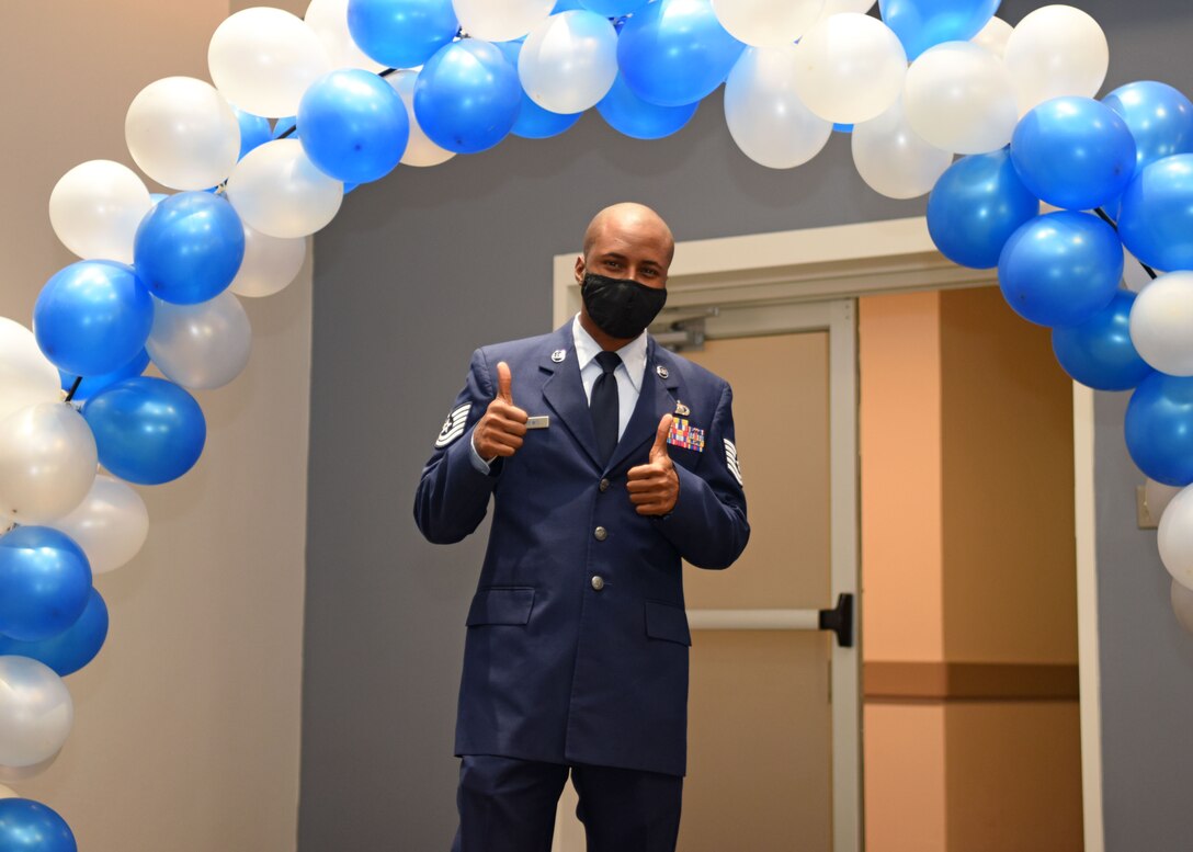 U.S. Air Force Tech. Sgt. Jordan Andrews, 316th Training Squadron instructor, gives a thumbs-up as he makes his way into the ballroom, during the Senior Noncommissioned Officer Induction Ceremony at the event center on Goodfellow Air Force Base, Texas, August, 27, 2020. Andrews was one of the 27 inductees recognized at Goodfellow. (U.S. Air Force photo by Airman 1st Class Ethan Sherwood)