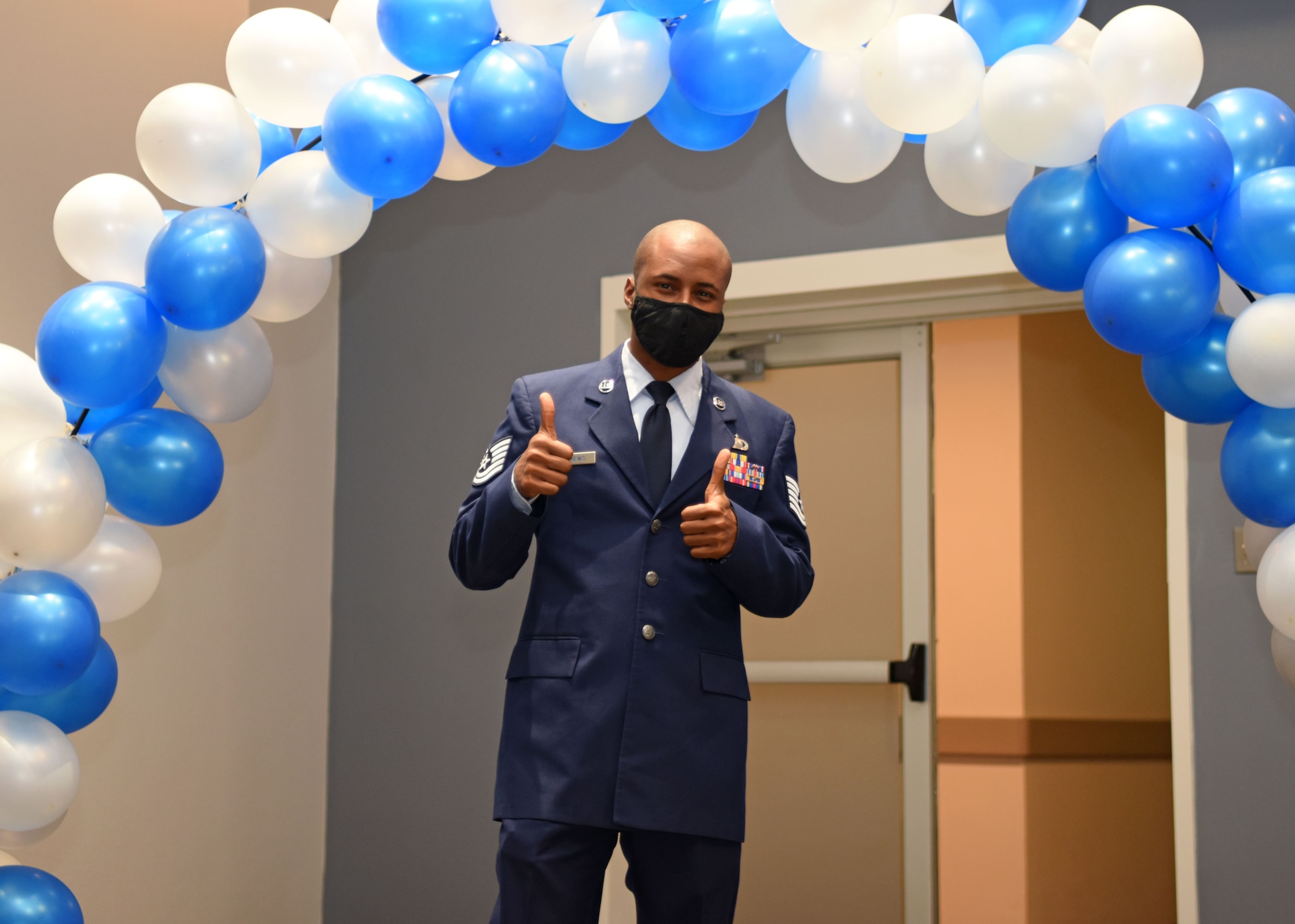 U.S. Air Force Tech. Sgt. Jordan Andrews, 316th Training Squadron instructor, gives a thumbs-up as he makes his way into the ballroom, during the Senior Noncommissioned Officer Induction Ceremony at the event center on Goodfellow Air Force Base, Texas, August, 27, 2020. Andrews was one of the 27 inductees recognized at Goodfellow. (U.S. Air Force photo by Airman 1st Class Ethan Sherwood)