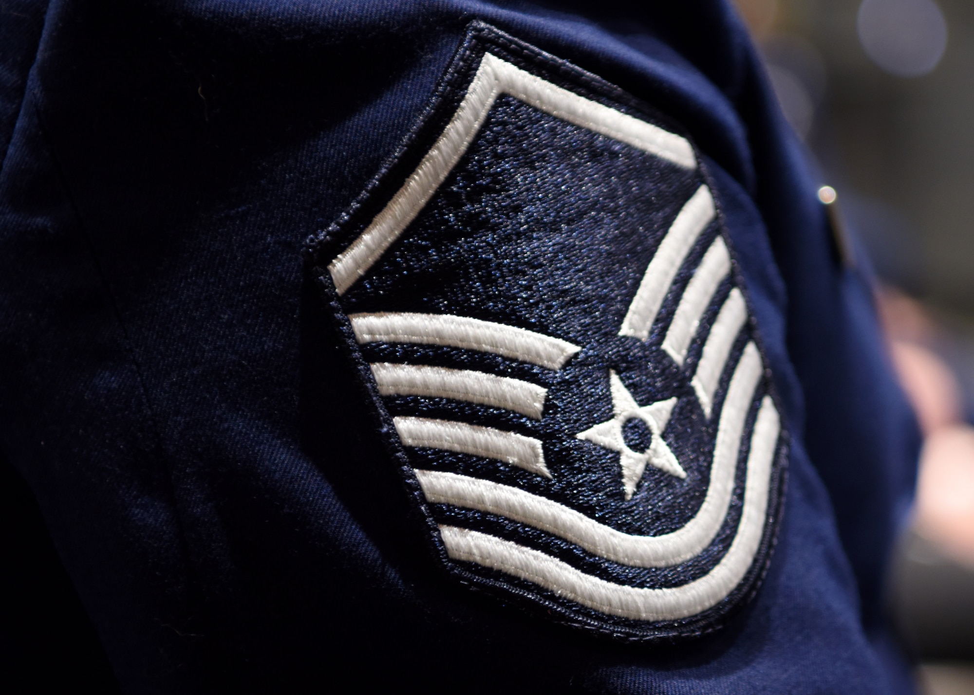 The rank of master sergeant rests on the sleeve of Master Sgt. Mickey Bretado, 313th Training Squadron, at the Senior Noncommissioned Officer Induction Ceremony at the event center on Goodfellow Air Force Base, Texas, Aug. 27, 2020. Becoming a master sergeant was the beginning of becoming an operational leader and the end of their role as the front line technicians of the Air Force. (U.S. Air Force photo by Airman 1st Class Ethan Sherwood)