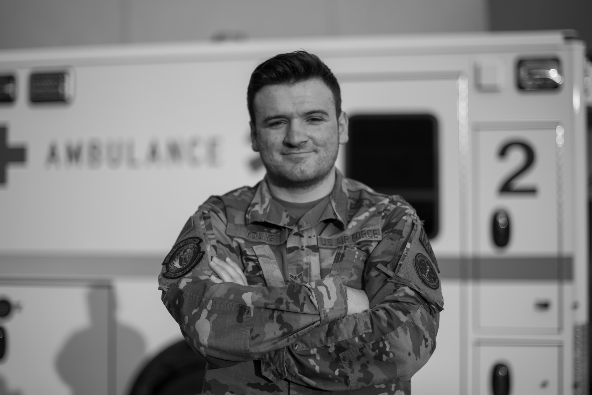 U.S. Air Force Airman 1st Class William Young, 60th Medical Operations Squadron emergency medical technician, stands in front of an ambulance Aug. 26, 2020, at Travis Air Force Base, California. Young was part of a team that evacuated 20 patients from David Grant USAF Medical Center Aug. 19 as the LNU Lightning Complex Fire, the second largest wildfire in California history, burned its way toward the base. (U.S. Air Force photo by Senior Airman Cameron Otte)