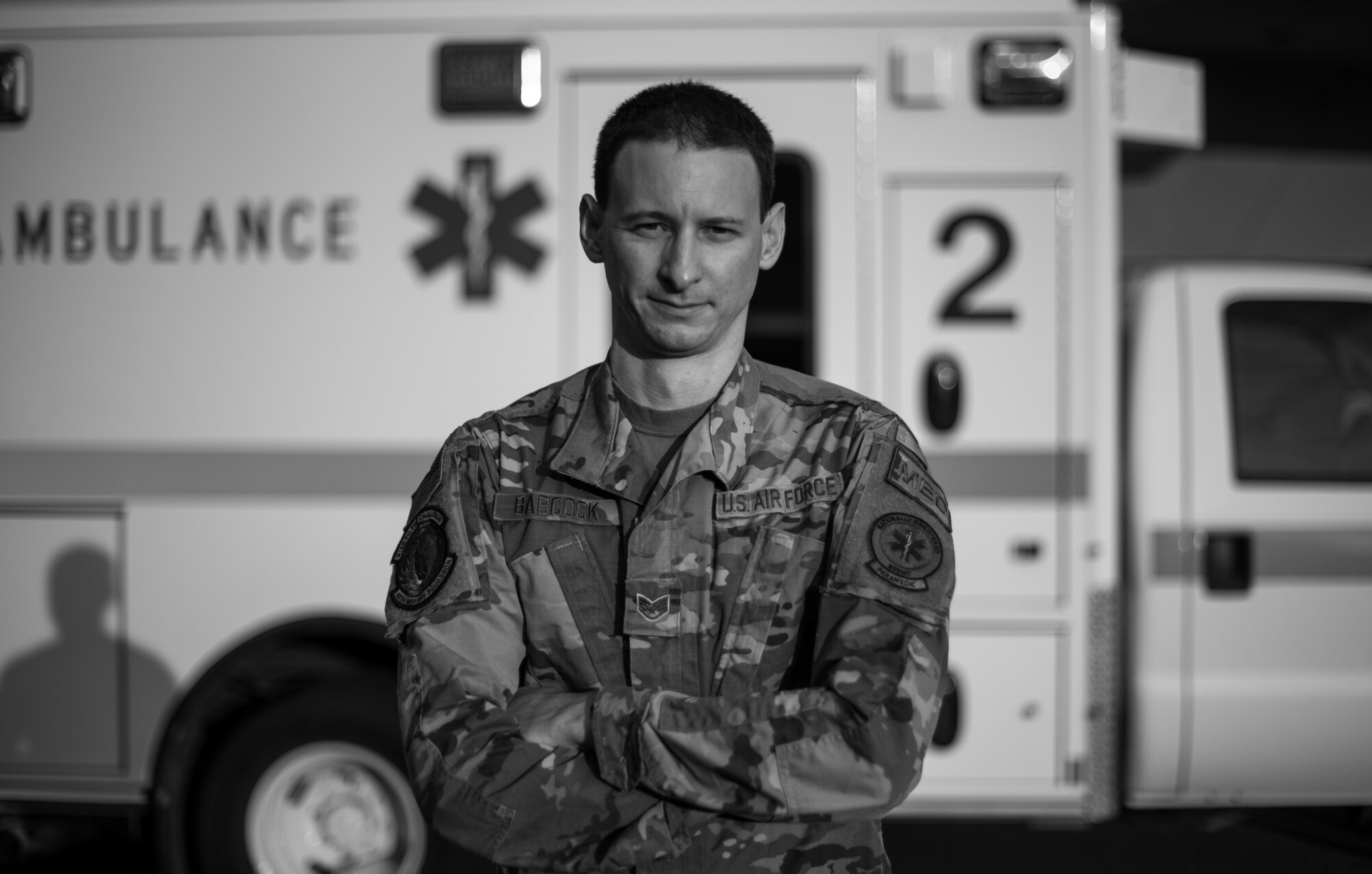 U.S. Air Force Staff Sgt. Christopher Babcock, 60th Medical Operations Squadron paramedic, stands in front of an ambulance Aug. 26, 2020, at Travis Air Force Base, California. Babcock was part of a team that evacuated 20 patients from David Grant USAF Medical Center Aug. 19 as the LNU Lightning Complex Fire, the second largest wildfire in California history, burned its way toward the base. (U.S. Air Force photo by Senior Airman Cameron Otte)