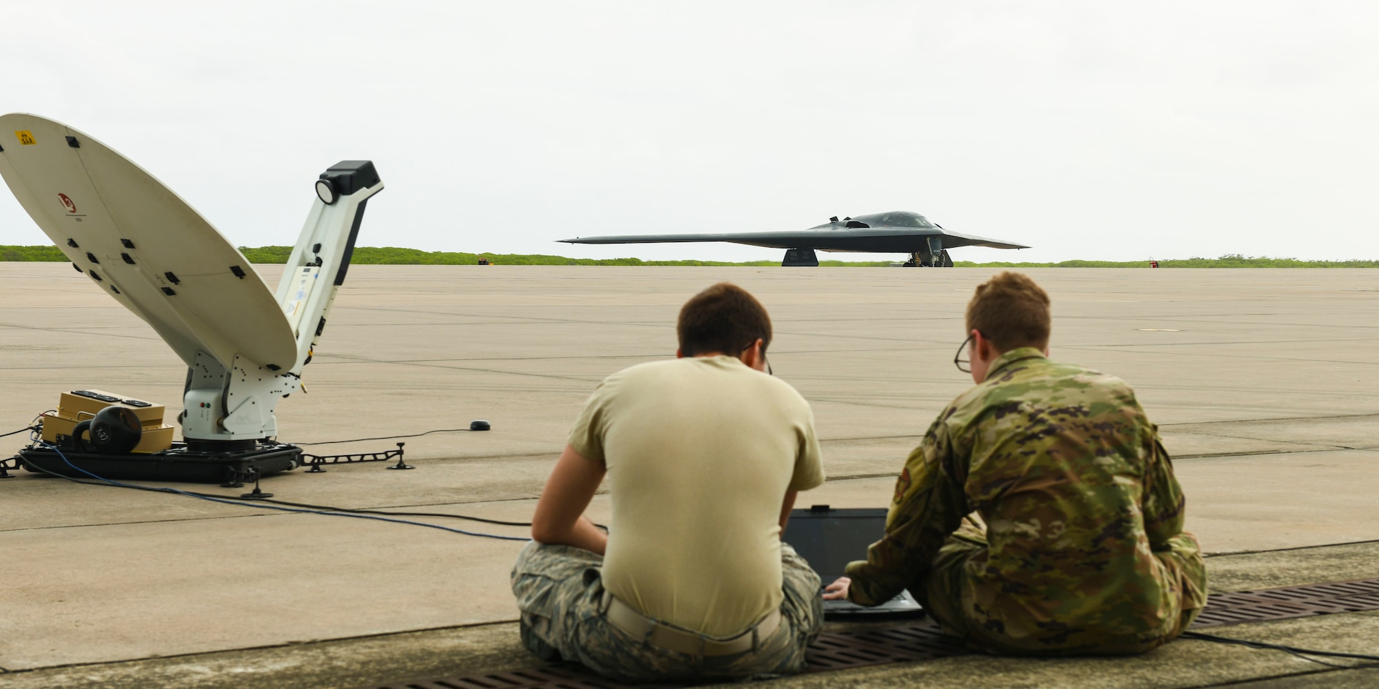 U.S. Air Force Senior Airman Patrick Corbin, 393rd Expeditionary Bomb Squadron communications support team, Whiteman Air Force Base, Missouri, and Senior Airman Brandon Kester, 374th Communication Squadron, Yokota Air Base, Japan, set up a statelite link to U.S. Air Force Global Strike Command’s first mobile operations center during a deployment to Naval Support Facility Diego Garcia, August 20, 2020. Air Force Global Strike Command’s development of the mobile operations center is based on the National Defense Strategy’s objective to build lethality, strengthen alliances and streamline processes. Once implemented across AFGSC, the mobile operations center will allow commanders across the world to employ bomber forces to ensure a free and open Indo-Pacific and ability of AFGSC to deliver lethal, ready, long-range strike options anytime, anywhere. (U.S. Air Force photo by Tech. Sgt. Heather Salazar)