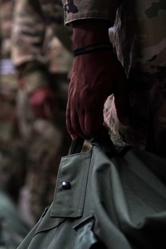 Basic military training trainees from the 737th Training Wing Detachment 5 wait in line to get their issued military clothing inspected inside the 81st Logistics Readiness Squadron warehouse at Keesler Air Force Base, Mississippi, Aug. 26, 2020. The 81st LRS worked with different Air Education and Training Command units to support BMT at Keesler by providing uniforms for trainees. (U.S. Air Force photo by Airman 1st Class Seth Haddix)