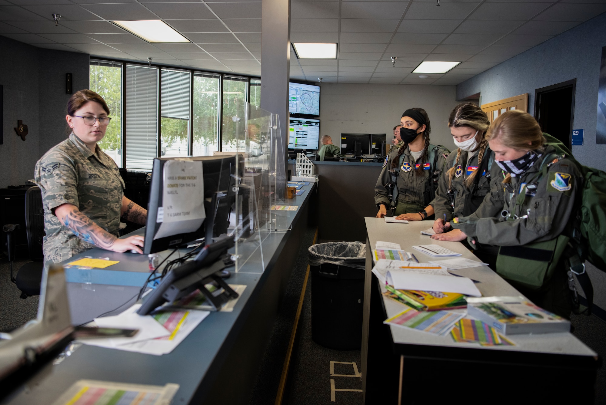 Airman 1st Class Cailey Brislin, 434th Squadron Aviation Resource Manager, finalizes flight plans for the all-female pilots flying in observance of Woman’s Equality Day at Laughlin Air Force Base, Texas, Aug. 26, 2020. Laughlin observes Women’s Equality Day by flying an all-female formation sortie with instructor and student pilots. (U.S. Air Force photo by Senior Airman Marco A. Gomez
