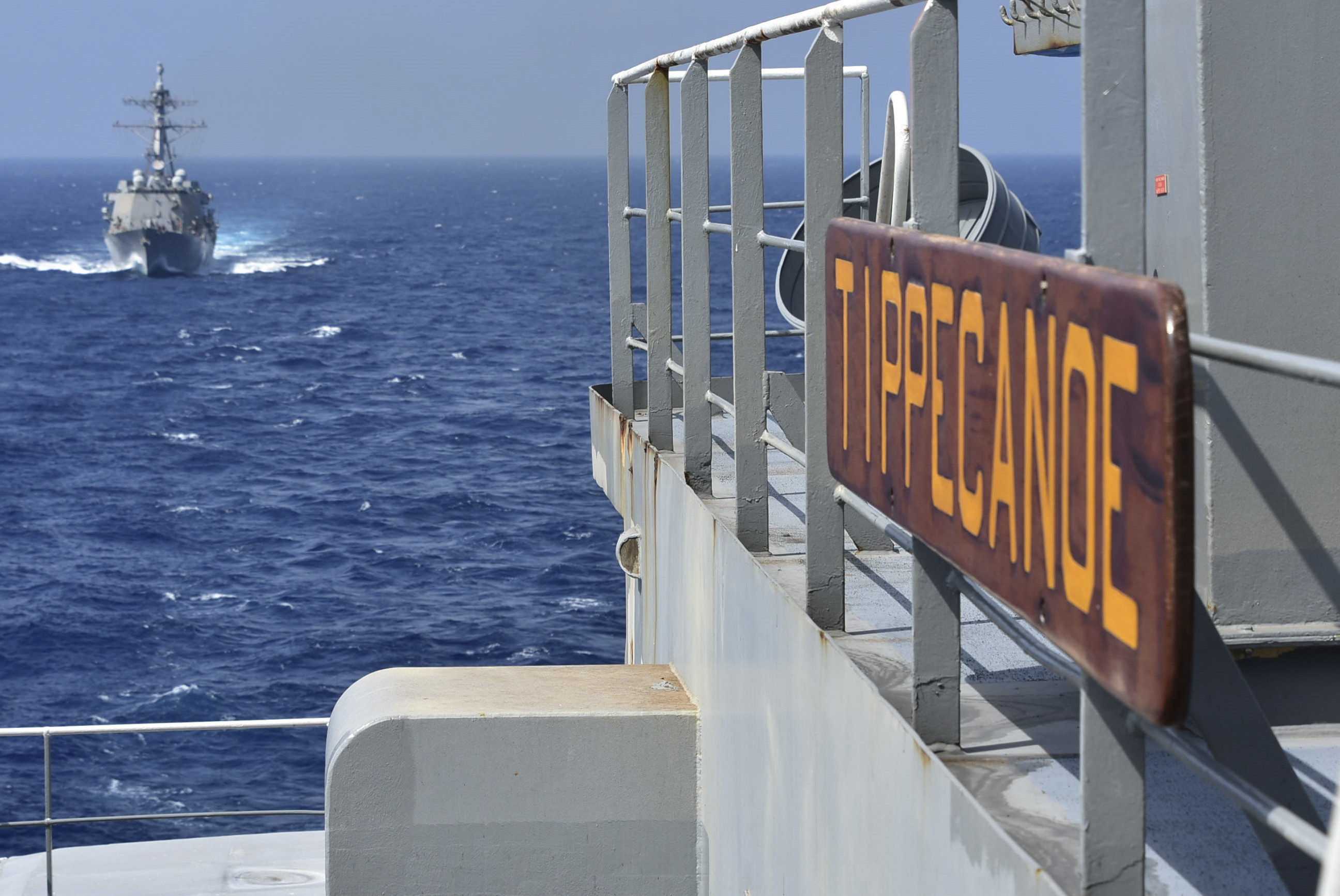 USS Mustin (DDG 89) pulls alongside the Henry J. Kaiser-class fleet replenishment oiler USNS Tippecanoe (T-AO 199) in preparation for an underway replenishment.