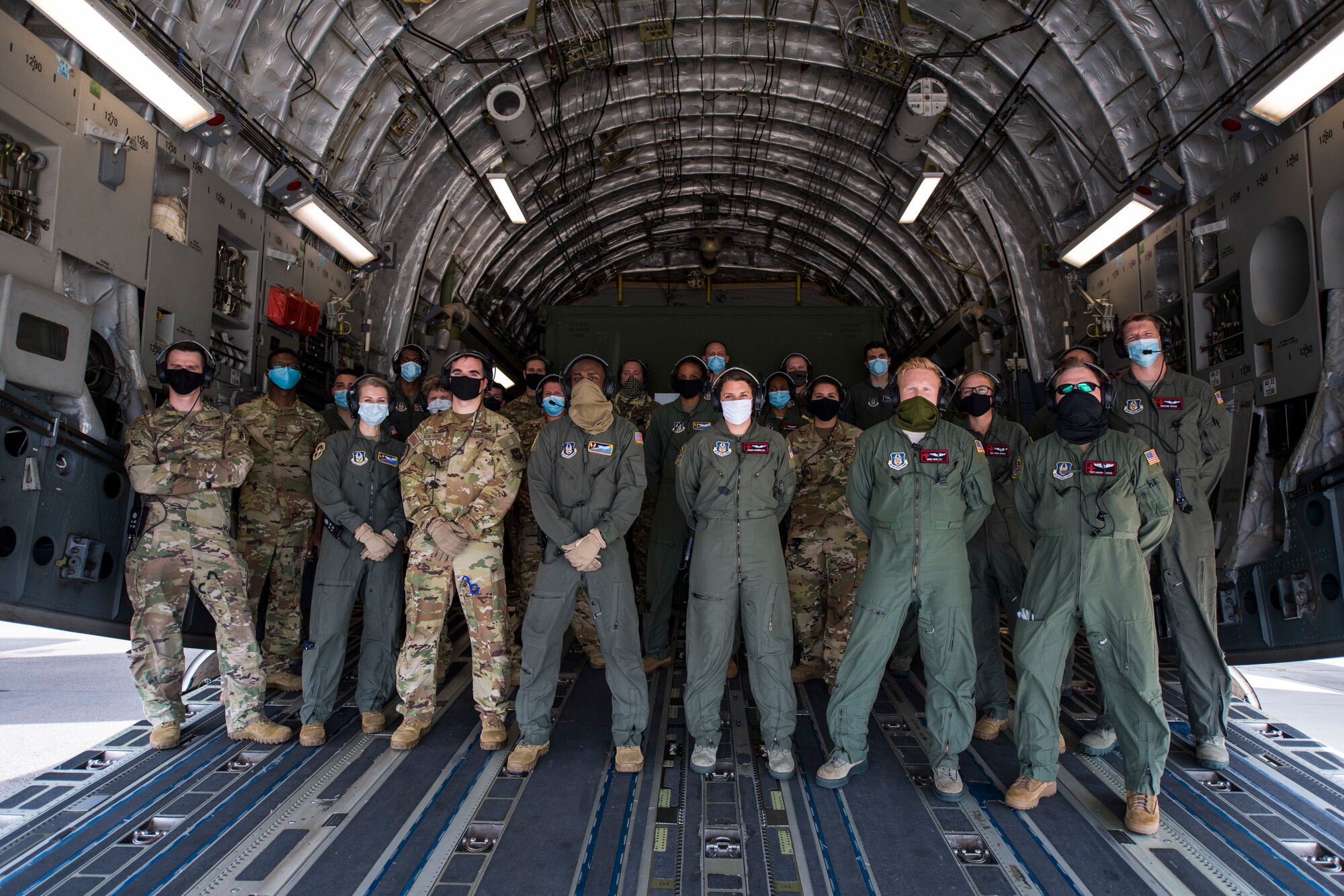 Members of the 908th Aeromedical Evacuation Squadron (AES), Maxwell AFB, Ala., and the 45th AES, stand together for a group photo onboard a C-17 Globemaster III aircraft assigned to the 512th Airlift Wing, Dover AFB, during a medical training exercise at MacDill Air Force Base, Fla., Aug. 21, 2020.