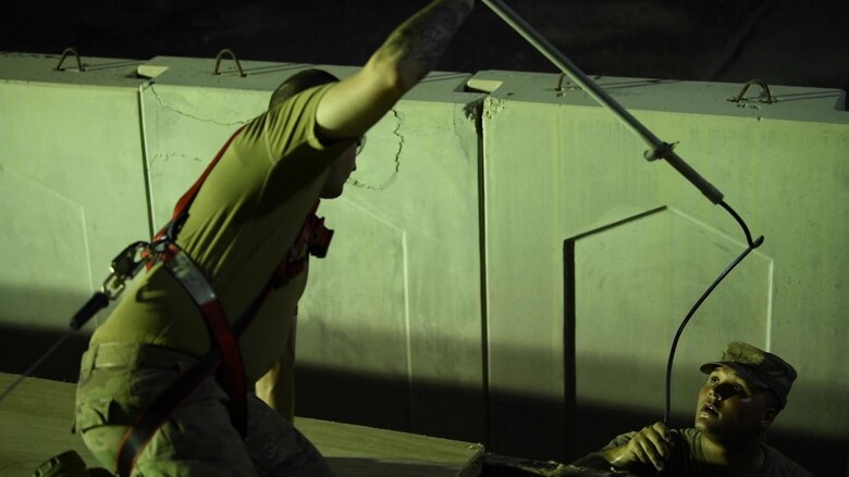 Airmen from the 380th Expeditionary Civil Engineer Squadron repair the roof of the Host Nation Coordination Office, July 8, 2020, at Al Dhafra Air Base, United Arab Emirates.