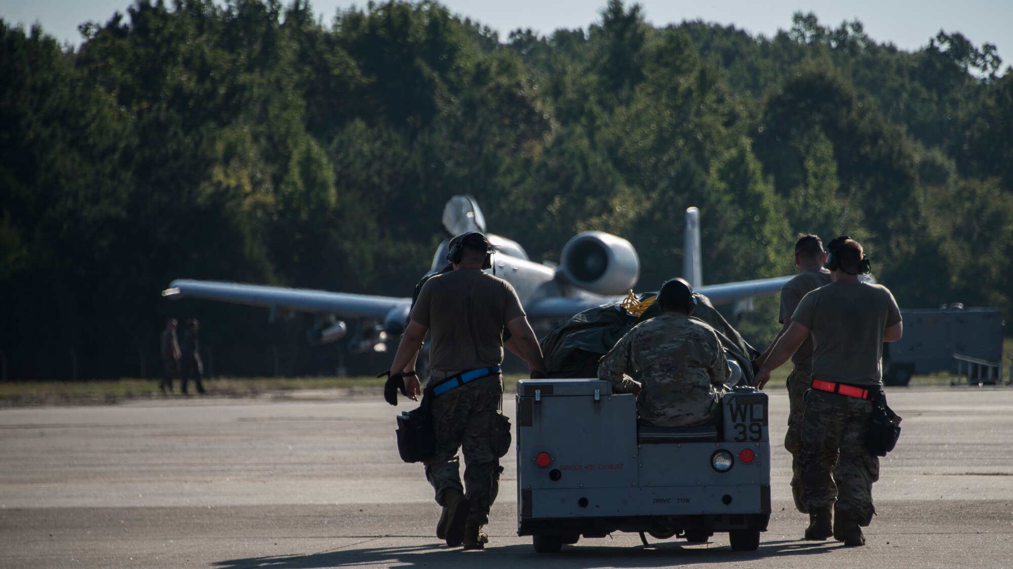 A photo of Airmen moving equipment