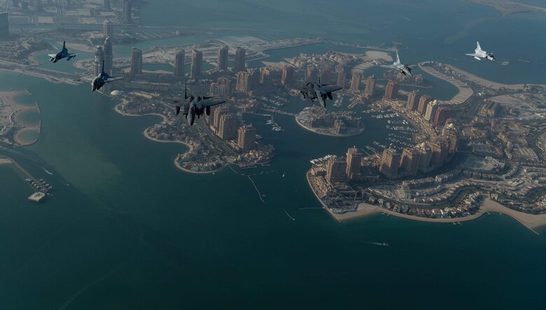 Qatari Emiri Air Force's (QEAF) Mirage 2000s and Rafales fly in formation over Doha, Qatar, alongside U.S. Air Force (USAF) F-15E Strike Eagles during the Qatar-U.S. Air Forces Central Command Friendship Event, Aug. 24, 2020.