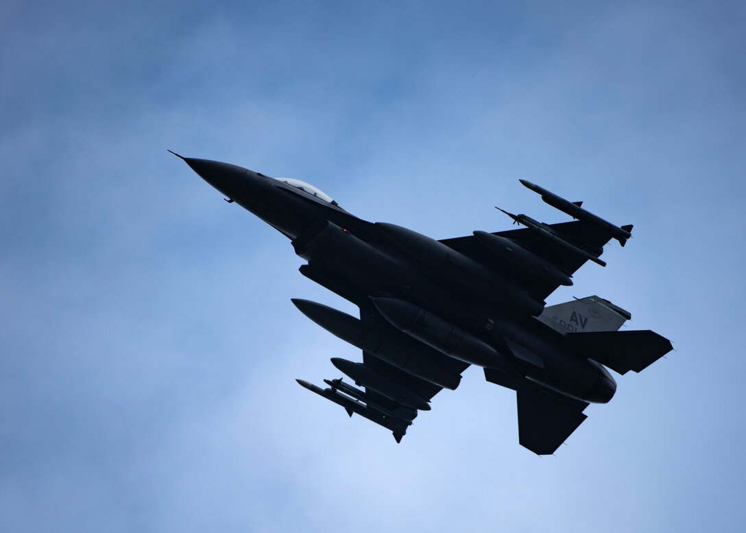 A U.S. Air Force F-16 Fighting Falcon, assigned to the 510th Fighter Squadron Aviano Air Base, Italy, flies over Royal Air Force Lakenheath, England, Aug. 28, 2020. Aircraft and Airmen from the 510th FS are participating in a flying training deployment event to enhance interoperability, maintain joint readiness and strengthen relationships with regional allies and partners. (U.S. Air Force photo by Airman 1st Class Jessi Monte)