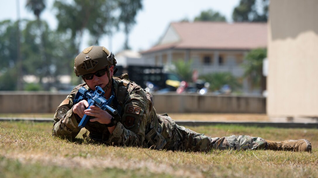 Airman in prone position with toy firearm