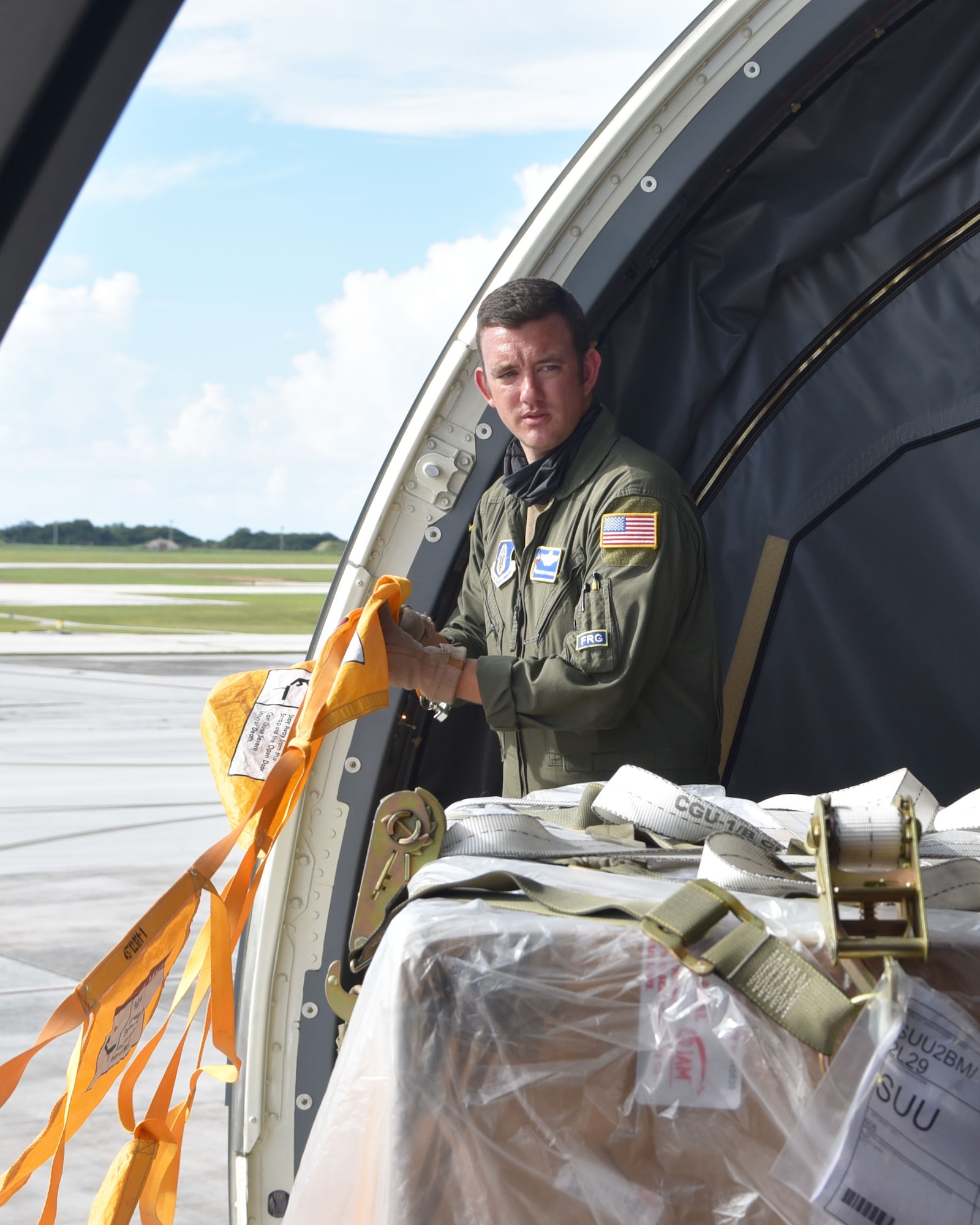 Senior Master Sgt. Aaron McLaughlin, 18th Air Refueling Squadron boom operator and load master, surveys a cargo pallet received from Andersen Air Force Base, Guam, Aug. 20, 2020, at Guam, AB. Transporting people and equipment on Air Force assets takes planning and preparation.  McLaughlin was part of a McConnell Reserve-lead aircrew that flew to Travis; Joint Base Pearl Harbor-Hickam Air Force Base, Hawaii, Andersen Air Force Base, Guam, and Royal Australian Air Force Base, Richmond, New South Wales, Australia.