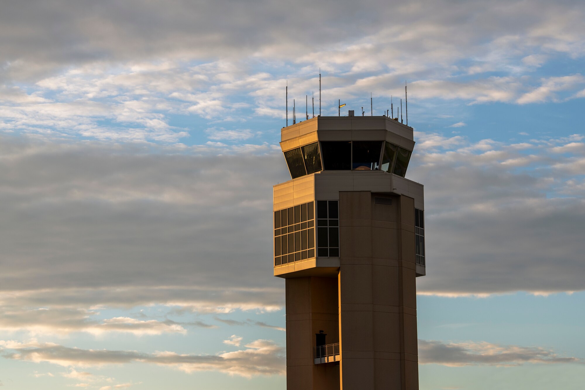 The sun sets on the air traffic control tower at Dover Air Force Base, Delaware, Aug. 13, 2020. The 436th Airlift Wing is home to the Department of Defense’s “Super Port”, C-17A Globemaster IIIs and the C-5M Super Galaxy. (U.S. Air Force photo by Senior Airman Christopher Quail)