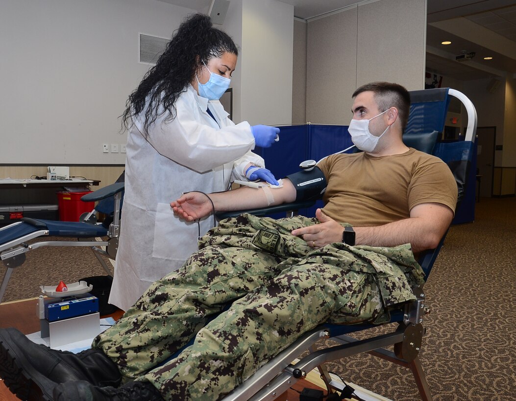 Lt. Alex Biggs, staff Judge Advocate at Naval Air Station Corpus Christi, donates blood during an Armed Services Blood Program blood drive at the station�s Catalina Club.