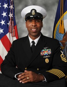 Official portrait of Command Master Chief Claude M. Henderson, Jr., assigned to Nimitz-class aircraft carrier USS Harry S. Truman (CVN 75).