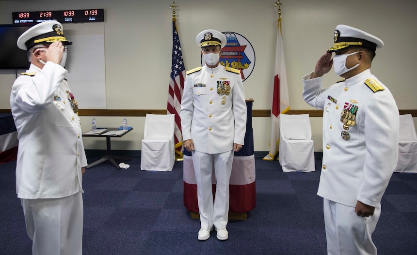 Rear Adm. James “Jimmy” Pitts, a native of Milton, Florida, relinquishes command to Rear Adm. Leonard Dollaga, a native of Vallejo, California, during Commander, Submarine Group 7’s (CSG7) change of command ceremony at Fluckey Hall. Vice Adm. William Merz, Commander, U.S. 7th Fleet presided over the ceremony.