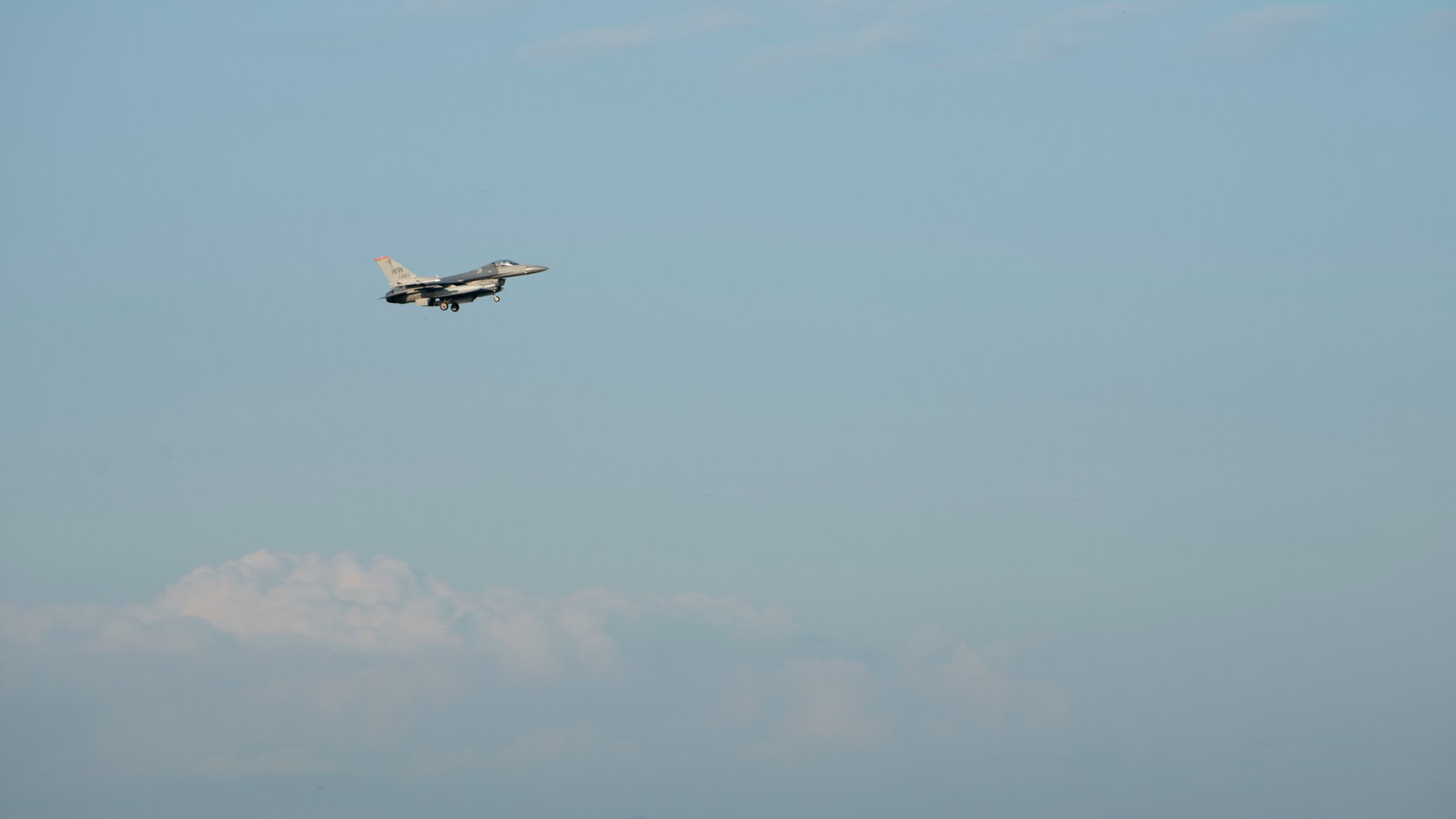 An F-16C Fighting Falcon begins its descent during Aviation Training Relocation at Chitose Air Base, Japan Aug. 27, 2020.
