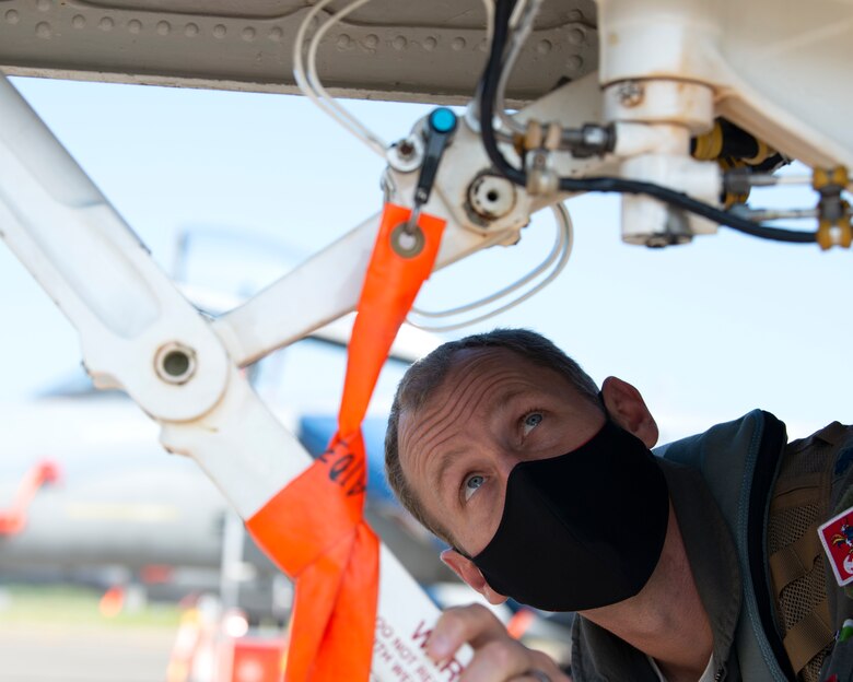U.S Air Force Lt. Col. Van Beusekom, 67th Fighter Squadron commander, performs a preflight walk-around on an F-16 Fighting Falcon during Aviation Training Relocation at Chitose Air Base, Japan Aug. 26, 2020.