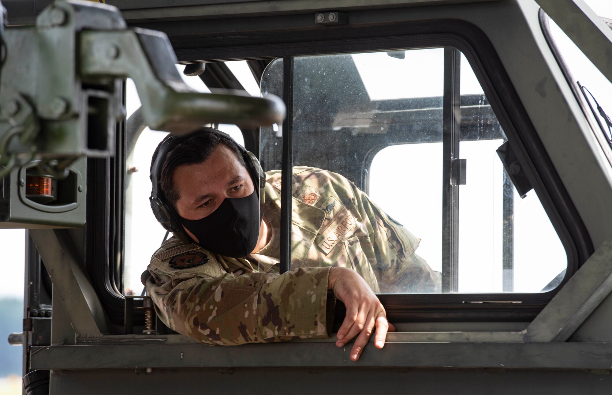 Staff Sgt. Angelo Llorente, 374th Logistics Readiness Squadron combat mobility flight supervisor, drives a K Loader up to a Japanese Air Self Defense Force C-130H Hercules at Yokota Air Base, Japan, Aug. 28, 2020.