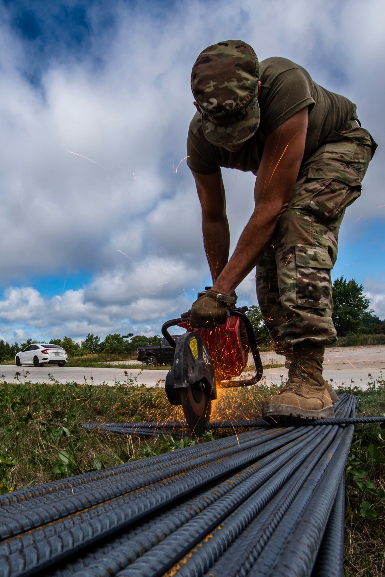 An Airman assigned to the 911th Civil Engineering Squadron cuts steel rebar to be used for a concrete pad frame at the Pittsburgh International Airport Air Reserve Station, Pennsylvania, Aug. 17, 2020.