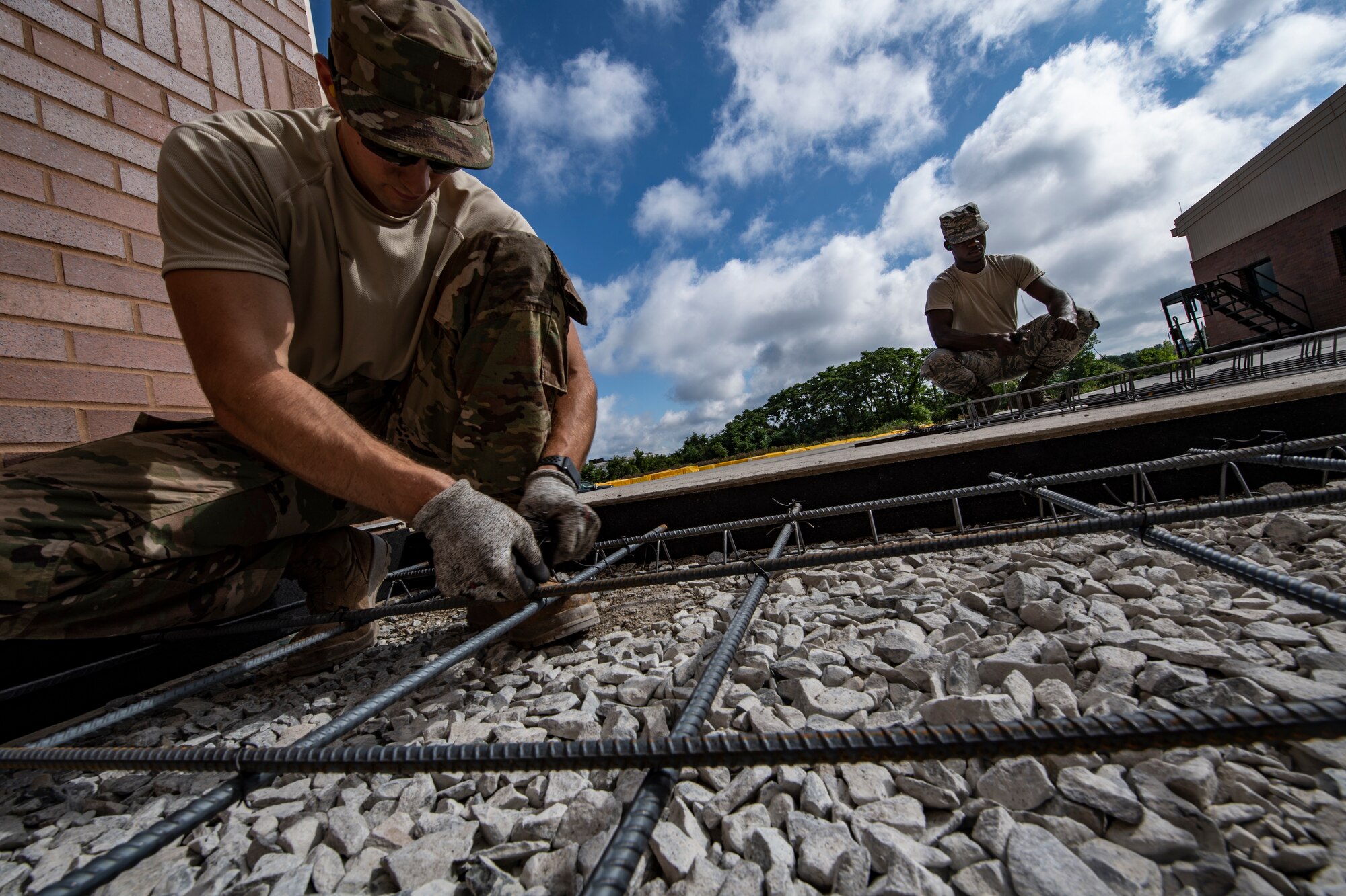 Airmen assigned to the 911th Civil Engineering Squadron construct a concrete pad frame at the Pittsburgh International Airport Air Reserve Station, Pennsylvania, Aug. 17, 2020.