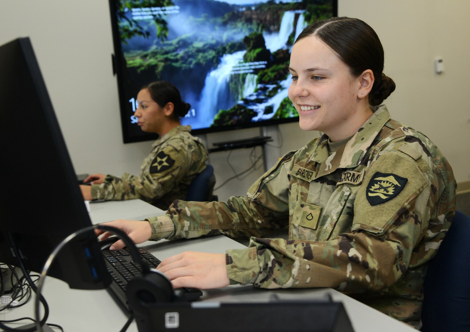 Members of the Oregon Army and Air National Guard work at the Anderson Readiness Center in Salem, Ore., helping the Oregon Employment Department process a backlog of unemployment claims, Aug. 1, 2020.