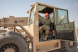 Pfc. Nicole Dubois sits in the cab of a fork lift on Camp Buehring, Kuwait, on July 29, 2020.  As an automated logistic specialist with Alpha Company, 834th Aviation Support Battalion she regular operates heavy machinery to move equipment and cargo around the Udairi Landing Zone airfield. (U.S. Army photo by Sgt. Sydney Mariette)