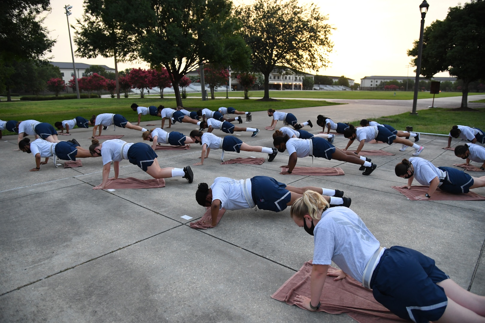 Female military trainees exercising.