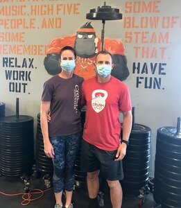 U.S. Air Force Master Sgt. Ronald Ebert, first sergeant, 140th Medical Group, 140th Wing, Colorado Air National Guard, and his wife, Alison, show that they’re ‘fit to fight’ at the gym where they routinely exercise and lead workouts. They helped save a fellow gym member’s life when he suffered a heart attack during a workout June 1, 2020.