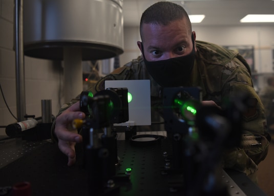 U.S. Air Force Dillon Gibbs, 312th Training Squadron Special Instruments Training course instructor supervisor, operates an interferometer to show how light behaves, at the Louis F. Garland Department of Defense Fire Academy on Goodfellow Air Force Base, Texas, Aug. 19, 2020. Gibbs exhibited the quantum effects of light in different scenarios for the SPINSTRA students. (U.S. Air Force photo by Senior Airman Abbey Rieves)