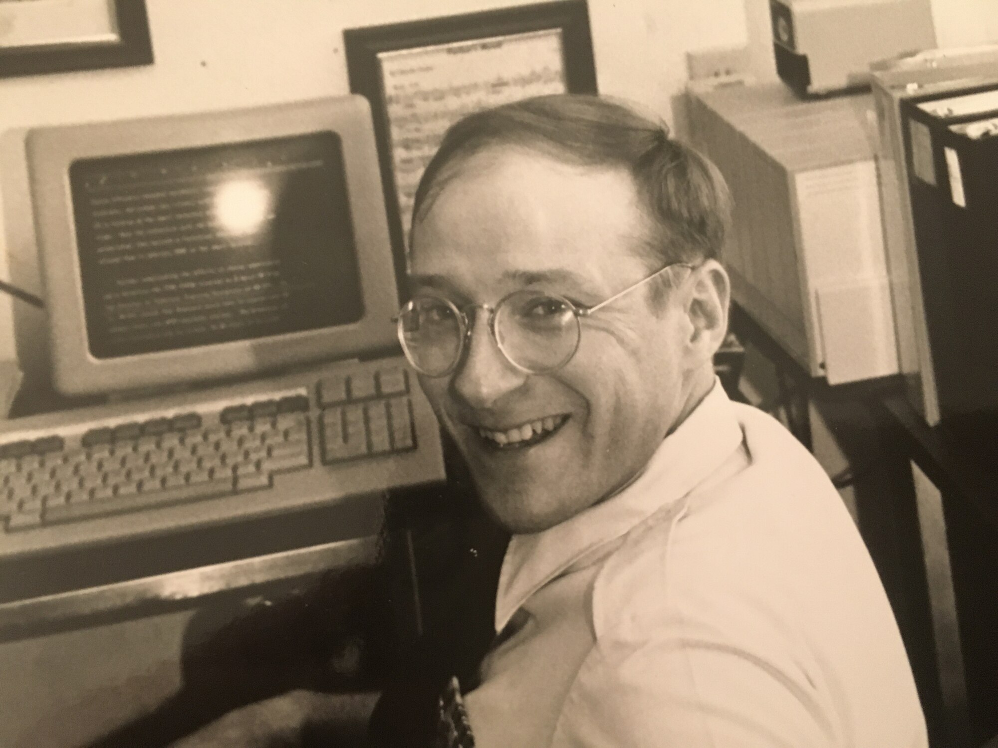 Gary W. Boyd, Air Education and Training Command historian,  poses for a photo in his office at the Sheppard Tech Training Center circa 1980, with a score sheet of Charlie Parker's “Parker’s Mood” on the wall behind him. (Courtesy photo)