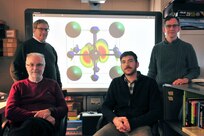 Researchers at the U.S. Naval Research Laboratory Center for Computational Materials Science, working with an international team of physicists, show that cesium lead halide perovskites nanocrystals (CsPbX3) — which atomic structure is shown on rear screen — emit light much faster than conventional light emitting materials