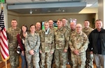 A group of 100th Missile Defense Brigade Soldiers stand for a photo with Colorado National Guard Lt. Col. George Lambos at UCHealth Memorial Hospital Central in Colorado Springs May 28, 2019. The Soldiers came so Lambos could participate in the promotion ceremony of one of his Soldiers.