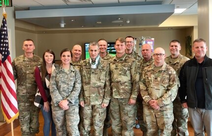 A group of 100th Missile Defense Brigade Soldiers stand for a photo with Colorado National Guard Lt. Col. George Lambos at UCHealth Memorial Hospital Central in Colorado Springs May 28, 2019. The Soldiers came so Lambos could participate in the promotion ceremony of one of his Soldiers.